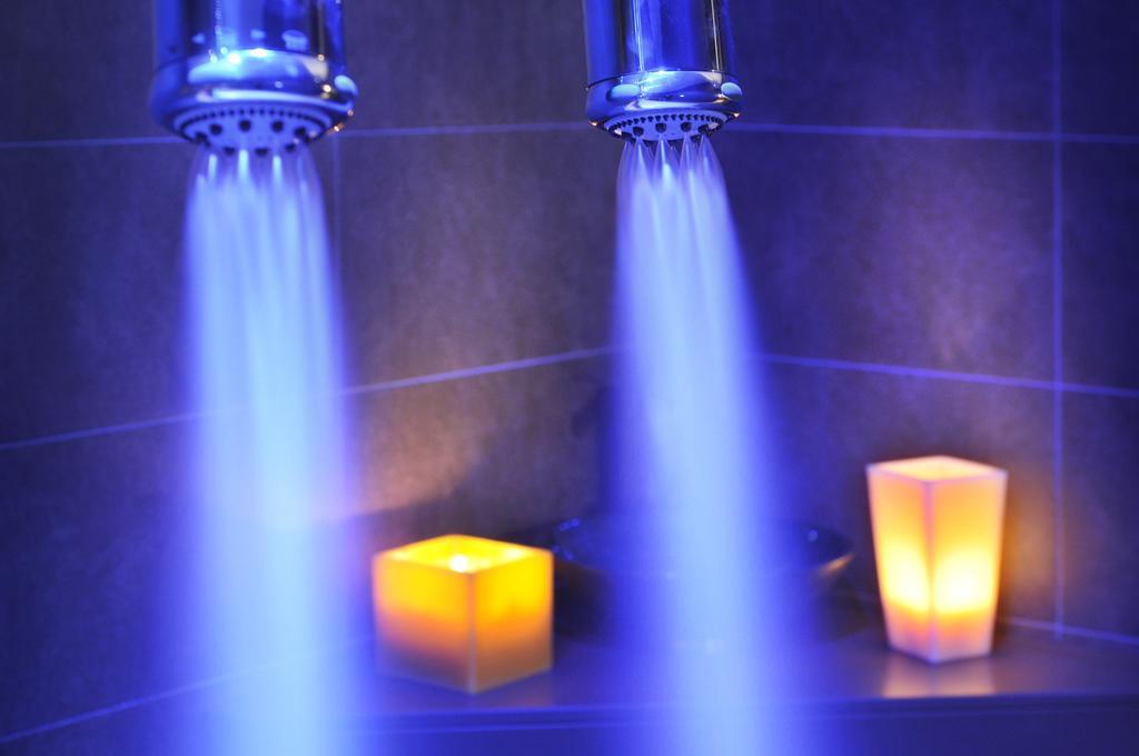 Sant Jordi Boutique Hotel Calella Exteriör bild A shower with blue LED lighting